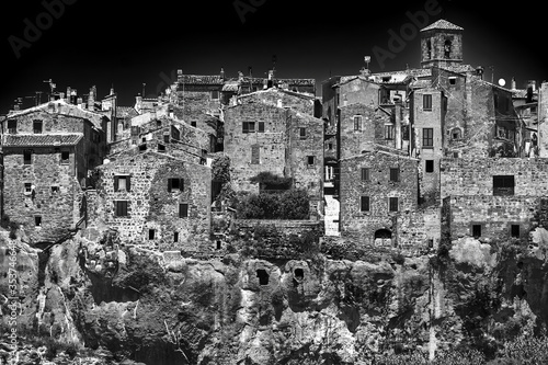 Medieval stone buildings on a rocky cliff in the town of Sorano in Tuscany, Italy.
