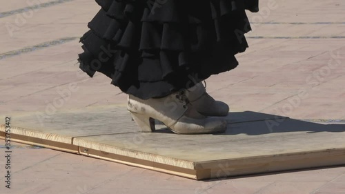 4K. Ultra HD. Woman practices flamenco dancing on a stage. Flamenco dancer in Seville, Spain.