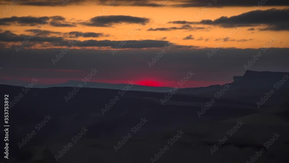 Sunset in mountains, the movement of clouds on the evening sky Sunset in mountains, the movement of clouds on the evening sky