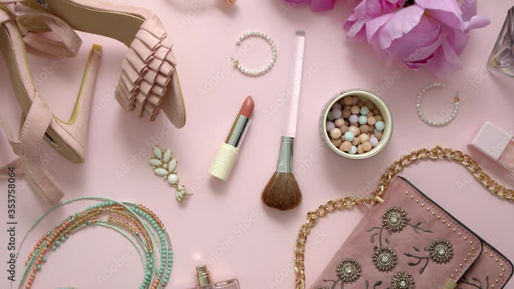 Beauty and fashion accessories and gadgets. Femine concept. Flat lay on pink theme background Beauty and fashion accessories and gadgets. Femine concept. Flat lay on pink theme background