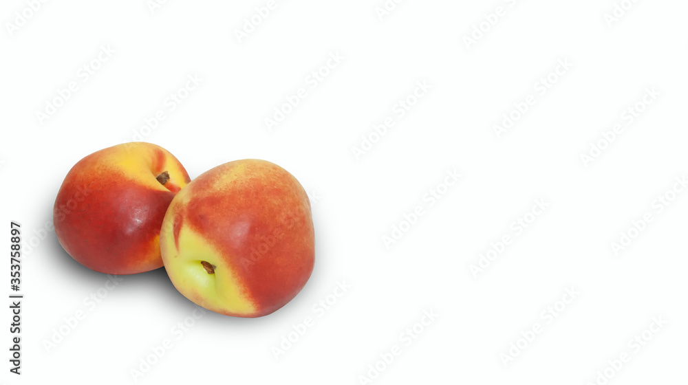 Two juicy and ripe nectarines isolated on a white background.