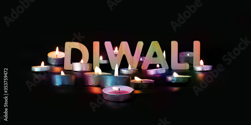 Diwali card, illuminated candles. Diwali text, dark panoramic background