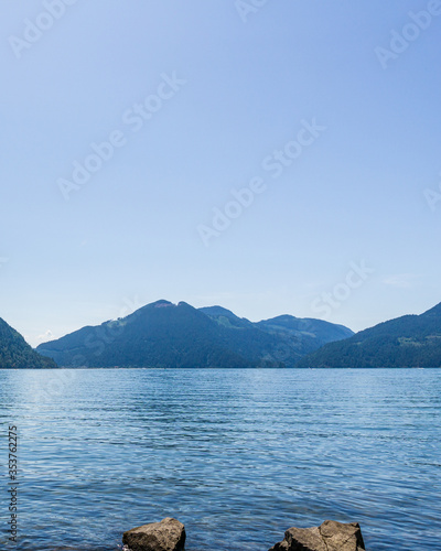 Blue clear sky over harrison lake british columbia canada background.