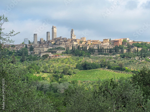 Cityscape Showing the Medieval Towers of San Giminano  ItalyThe Medieval towers of San Gimignano rise above the cityscape and hills of Tuscany  Italy  surrounded by olive groves and vineyards.