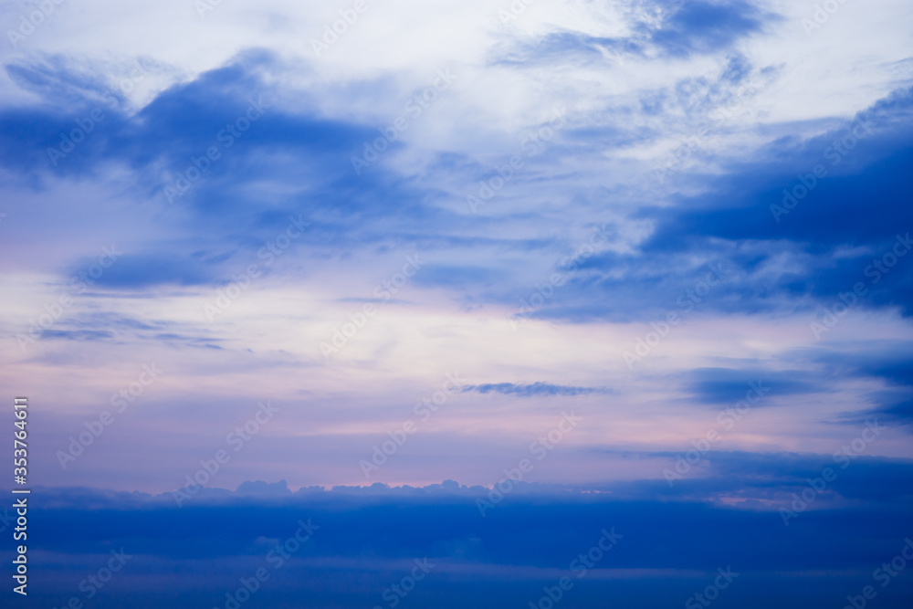 Sunset sunrise and beautiful twilight fluffy storm cloudy blue and yellow sky smoothly flowing to fantastic mind. Rainy good evening and have a nice day concept. Sunset sunrise and beautiful twilight fluffy storm cloudy blue and yellow sky smoothly flowing to fantastic mind. Rainy good evening and have a nice day concept.