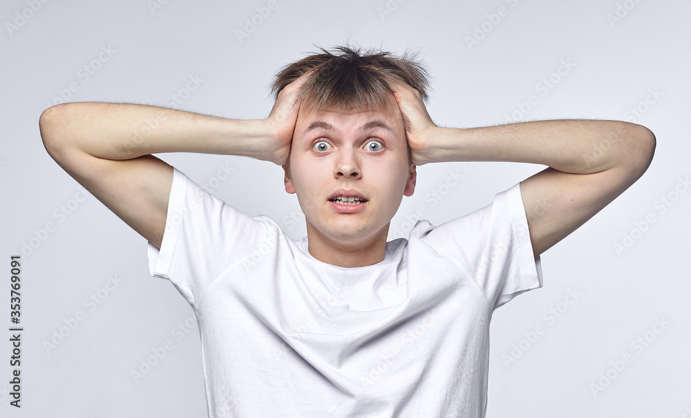 The young guy shows various emotions. Talented portrays the inner state and mood. Advertisement concept The young guy shows various emotions. Talented portrays the inner state and mood. Advertisement concept