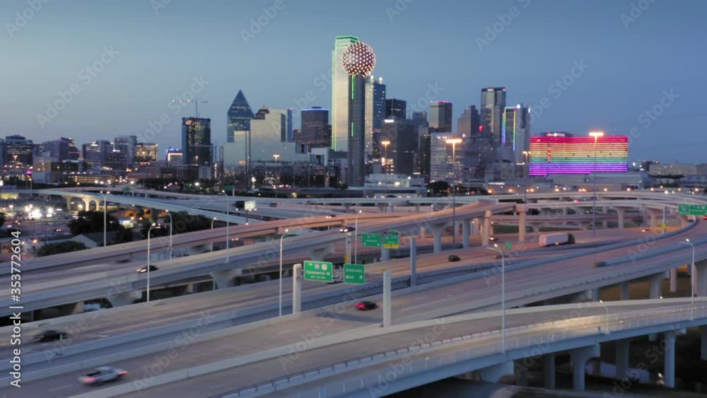 Aerial flying over Freeway traffic and downtown Dallas skyline at night. Texas, USA Aerial flying over Freeway traffic and downtown Dallas skyline at night. Texas, USA