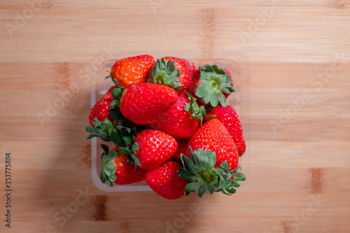 Fresh red strawberries on a wooden board