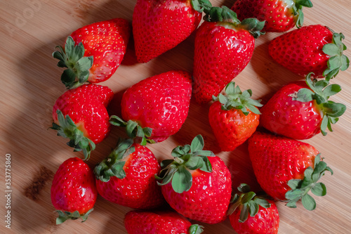 Fresh red strawberries on a wooden board