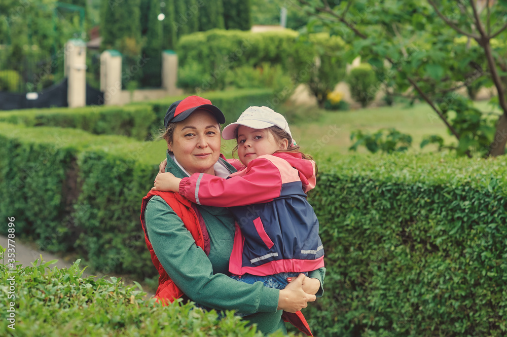 Fototapeta premium Mother with a little daughter on a walk . Outdoor family walks