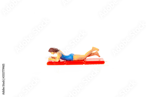 Miniature people office, worker and swimming beach sport concept in variety action on white background 