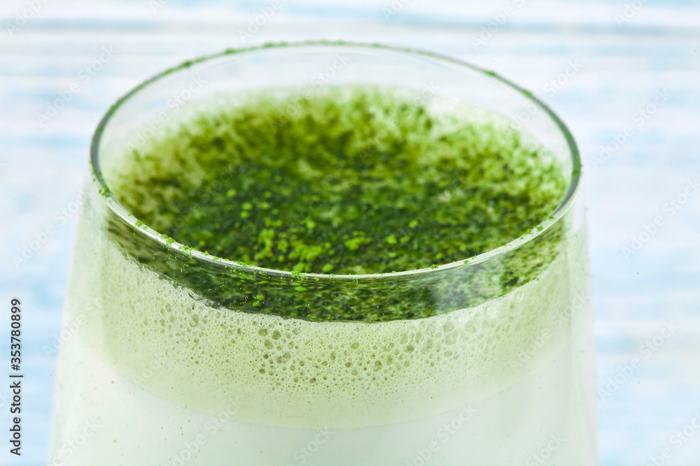 Dalgona Matcha Latte on a white wooden background. Dalgona Matcha Latte on a white wooden background.