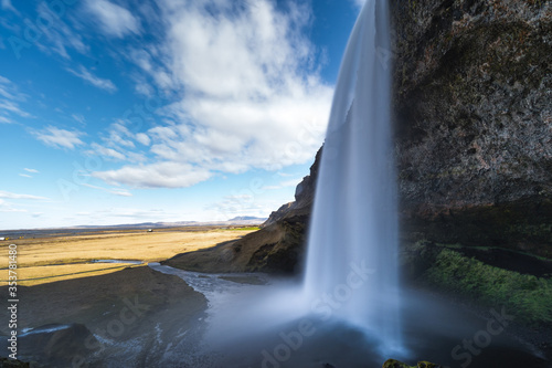 Fototapeta Naklejka Na Ścianę i Meble -  One of the most famous waterfalls in Iceland called Seljalandsfoss is located in the Golden Circle and is easy accessible from the Ring Road