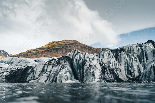 One of the most popular glaciers within the Golden Circle in Iceland is called Solheimajokull and is located near the town of Vik photo
