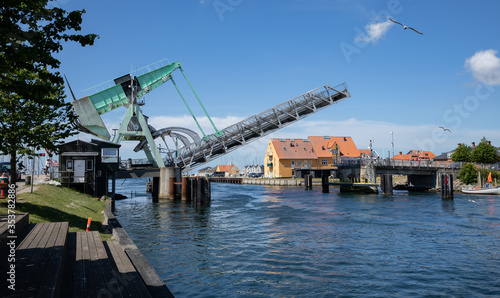 Bridge opening for a ship with blue sky and clouds