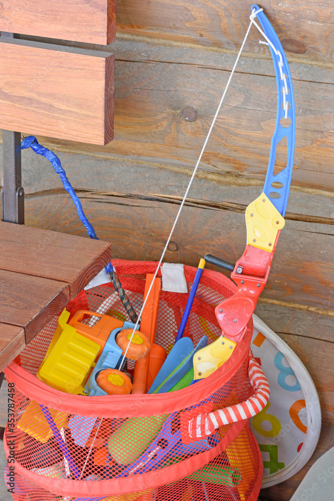 Children's toys are in a plastic basket