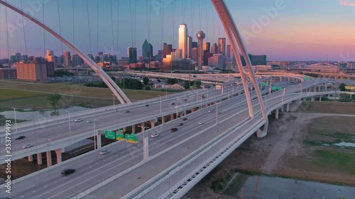 Aerial: Traffic crossing the Margaret Mcdermott Bridge over the Trinity River & downtown Dallas at night. Texas, USA photo