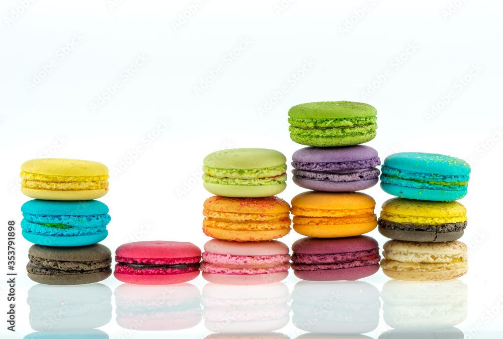 Fototapeta premium Colorful macarons on white background. Macaron or Macaroon is sweet meringue-based confection.