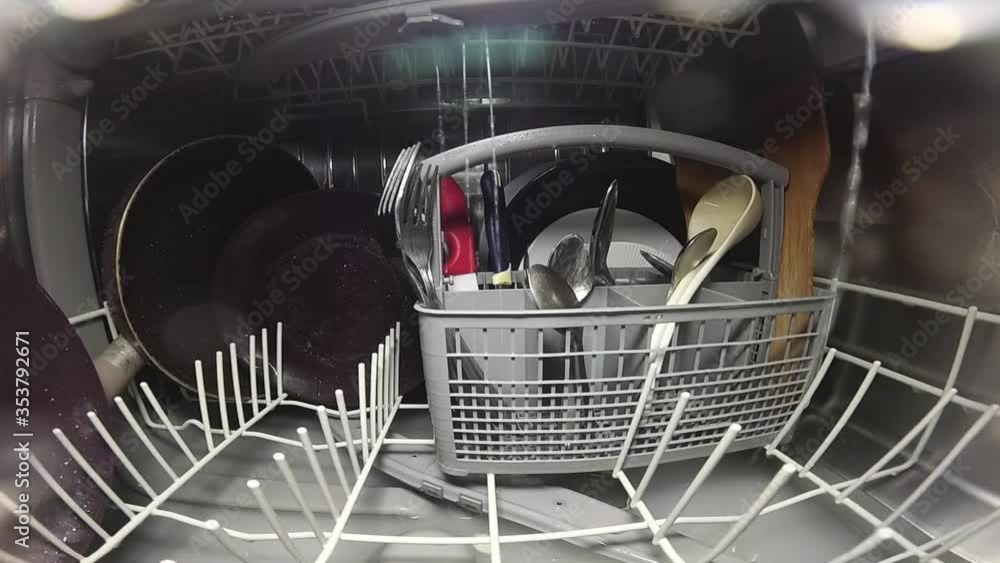 Stockvideo Slow motion. The master repairs the dishwasher and checks