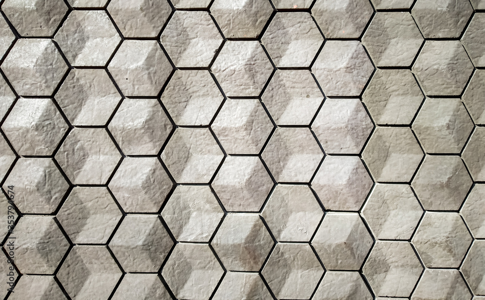 vitrified tiles in a hexagonal geometrical pattern with grey and white texture vitrified tiles in a hexagonal geometrical pattern with grey and white texture