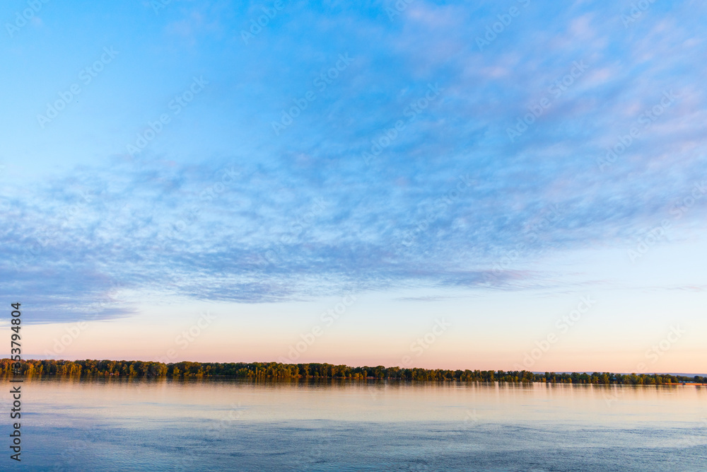 Magic dawn over a wide river