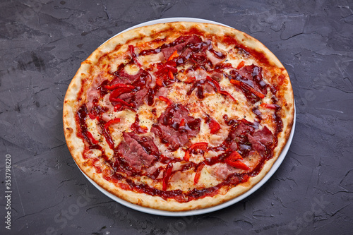 pizza with bacon, salami and mozzarella