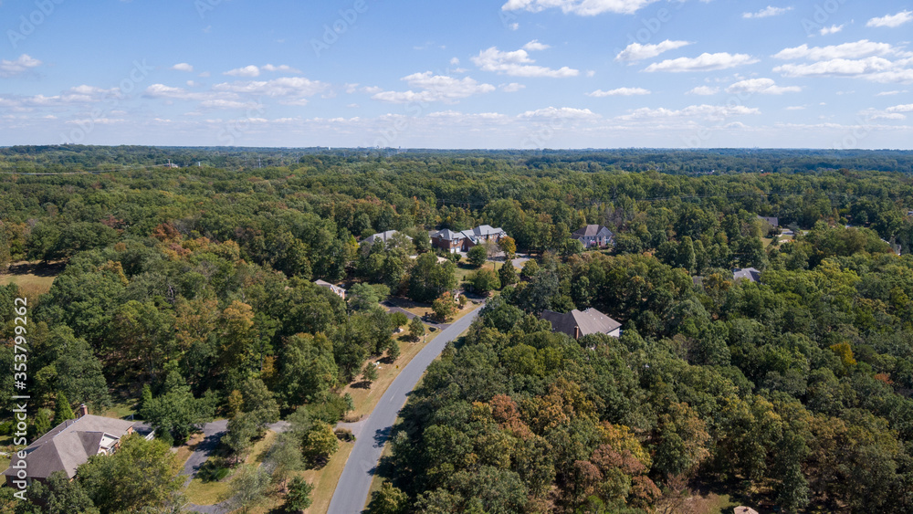 Aerial view of the Palatine neighborhood in Potomac, Montgomery County, Maryland. Fall foliage is in it's early stages. 