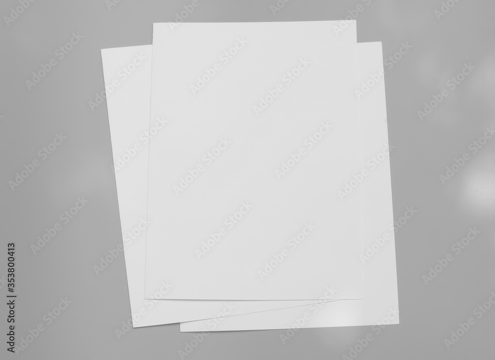 Poster white mock-ups paper isolated on gray background, Blank portrait paper A4. brochure, can use banners magazine products business texture. Poster white mock-ups paper isolated on gray background, Blank portrait paper A4. brochure, can use banners magazine products business texture.