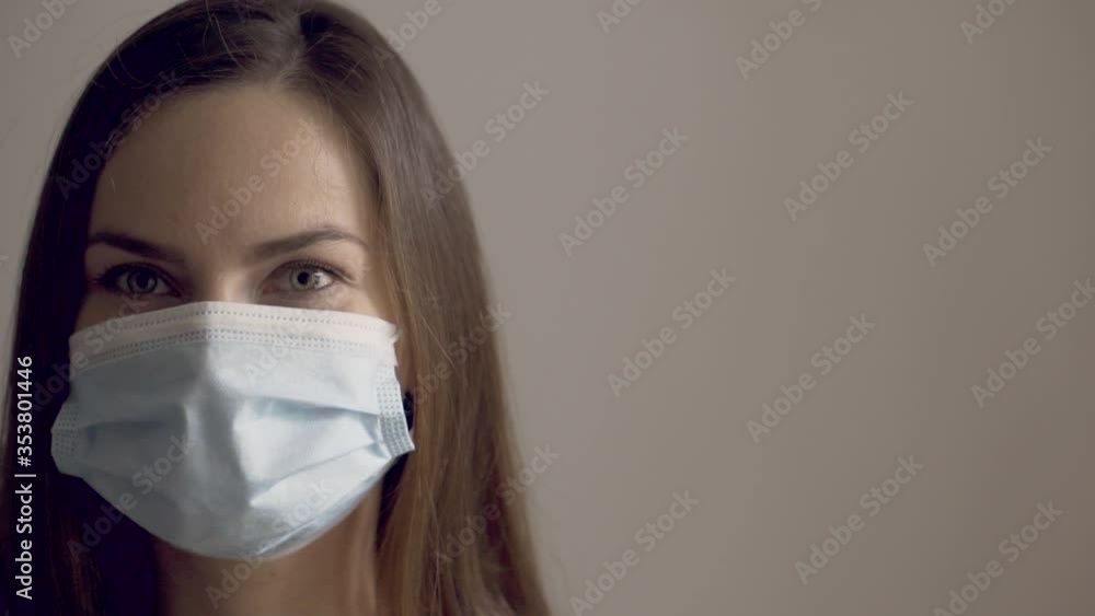Woman get tired of wearing the medical face mask Woman get tired of wearing the medical face mask