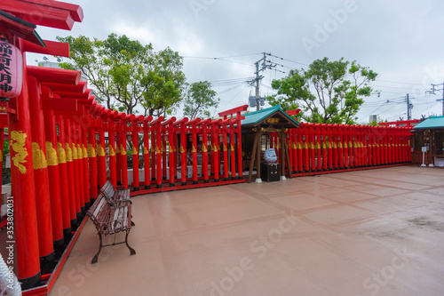 Red Tori gate at Sairaiin (Daruma Temple) in Naha, Okinawa, Japan 