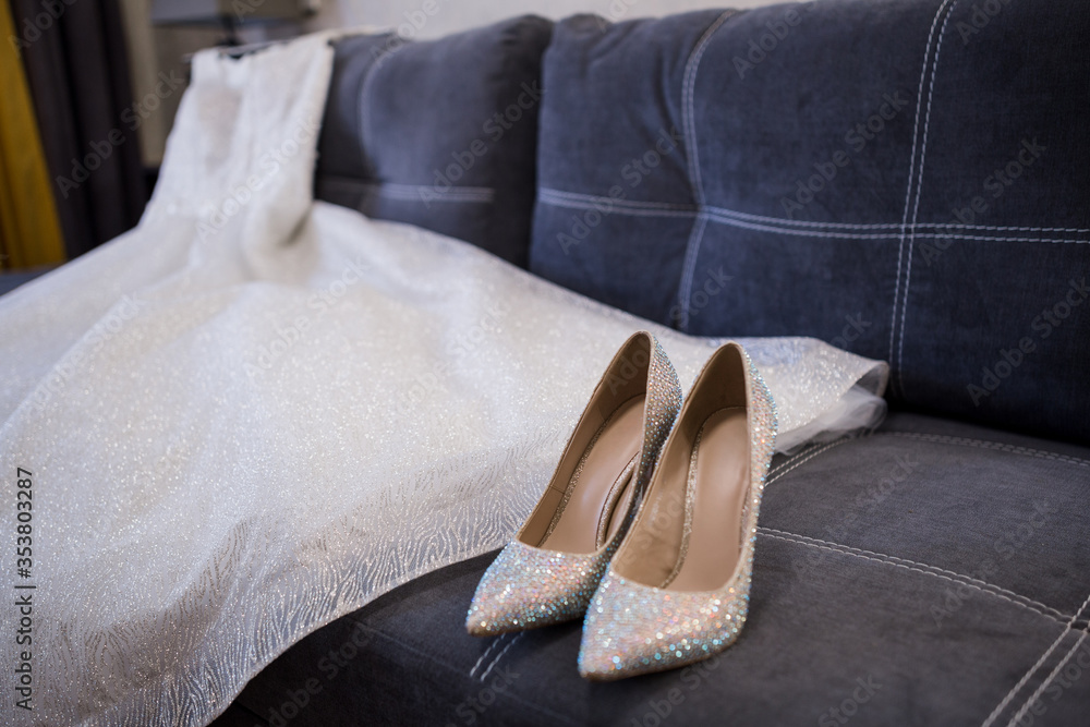 shoes of the bride near the wedding dress shoes of the bride near the wedding dress
