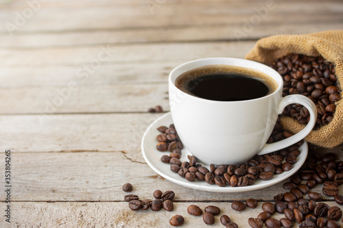 black coffee in a coffee cup isolated on wood background. with clipping path.