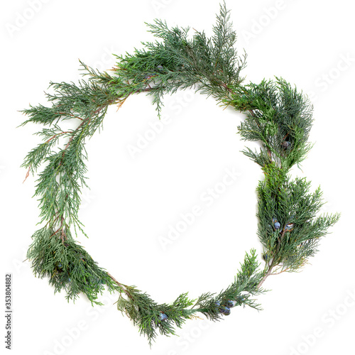 Christmas wreath of juniper on a white background top view . 