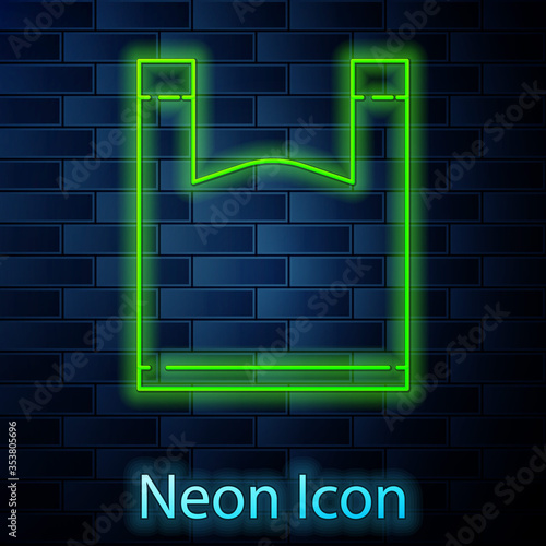 Glowing neon line Plastic bag icon isolated on brick wall background. Disposable cellophane and polythene package prohibition sign. Vector Illustration
