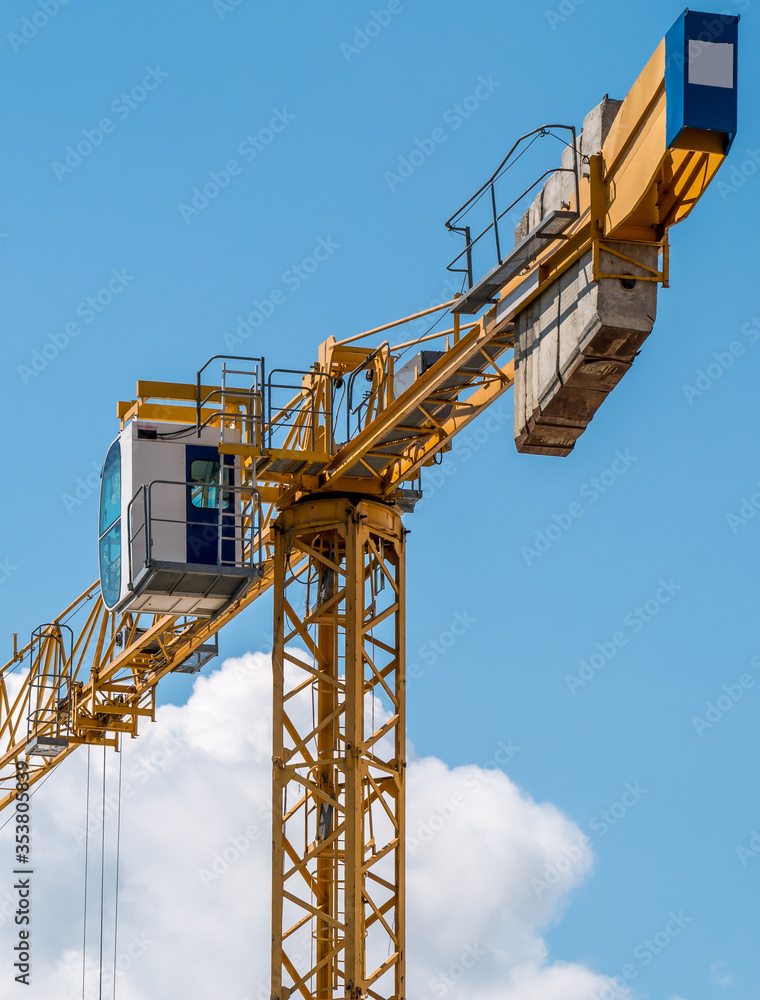 Close up details of a construction crane.Turret Slewing Crane against blue sky Close up details of a construction crane.Turret Slewing Crane against blue sky