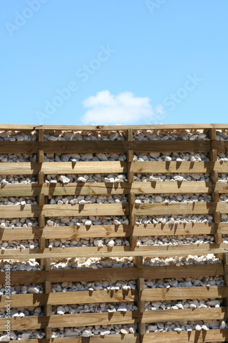 Wall made with wood and stone