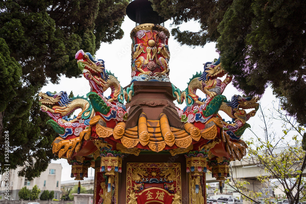 Detail images of colorful Taoist temple with dragons and gods to protect farmers and farms in rural part of Hsinchu