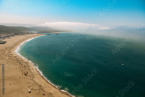 View from above of a beach in the coast of Portugal with tourists enjoying the sun © J.R. Baizán