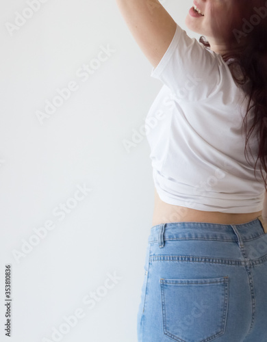  Attractive sexy girl with a magnificent figure. Young girl in a white T-shirt with long hair, sexy shapely forms