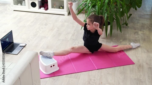 girl sports home. gymnastics online. able to do splits. fitness on quarantine