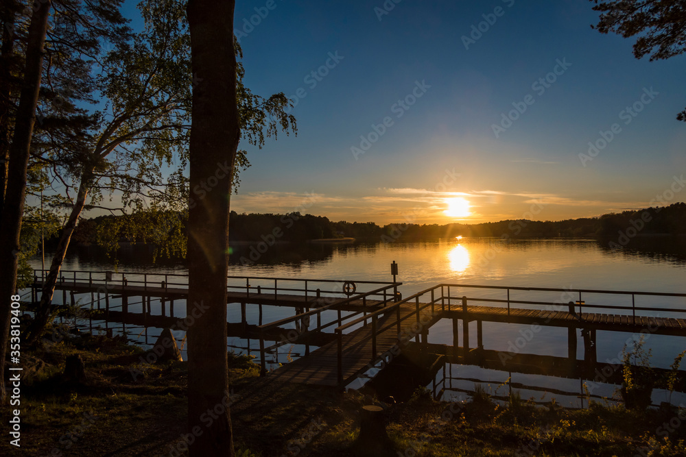 Stockholm, Sweden The suns sets over a dock on Lake Malaren.
