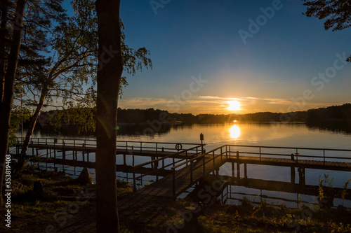 Stockholm, Sweden The suns sets over a dock on Lake Malaren.