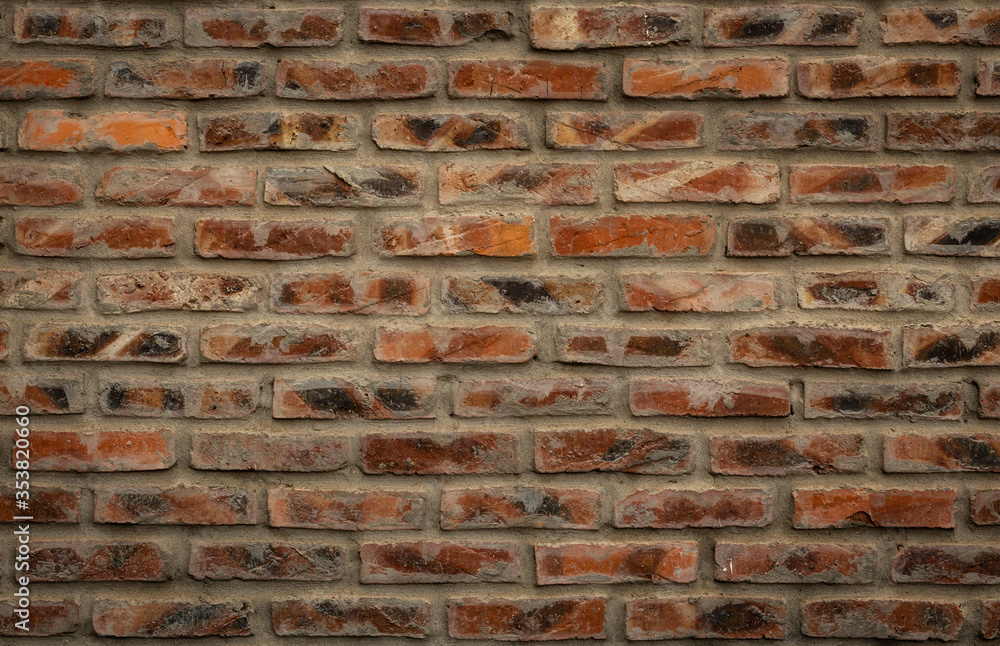 Naklejka premium Orange brick wall texture background