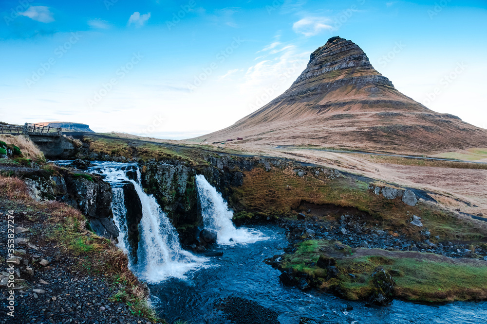 Kirkjufell mountain in the village of Grundarfjorur in western Iceland and its Kirkjufellfoss waterfall,