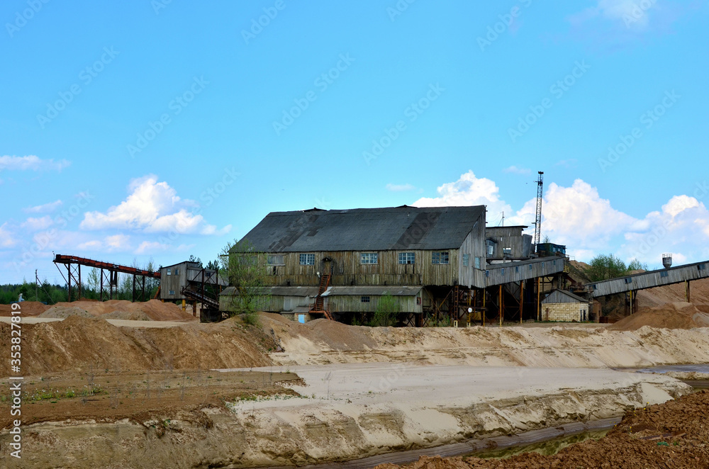 Sand making plant in mining quarry. Crushing factory with production line for crushing, grinding stone, sorting sand and bulk materials. Sand washing for the construction industry