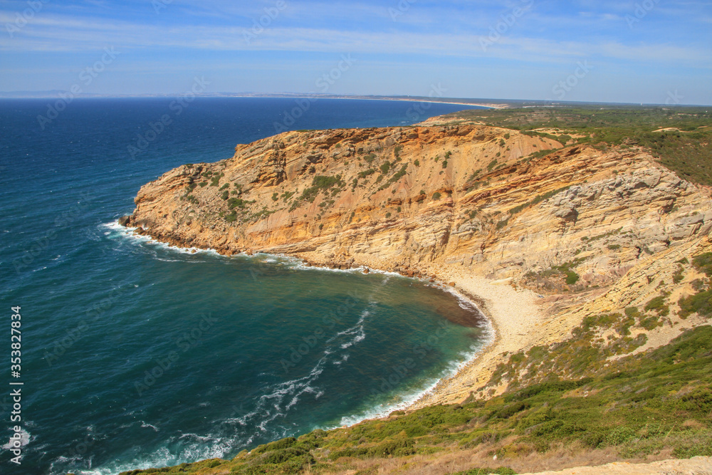 Bay with beach on rocky atlantic coastline of Portugal