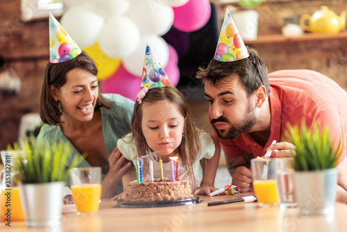 Family celebrating birthday together photo