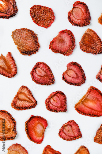 Strawberry Chips on a white background. Dried and fresh strawberries on a white background.