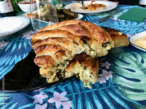 Delicious Balkan Meat Phyllo Pie Called Borek / Burek with Spinach. photo