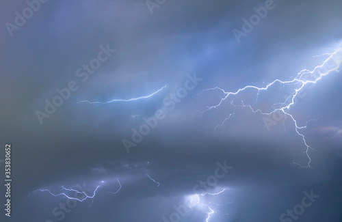 Thunderstorm with lightning bolts. Night rainy sky.
